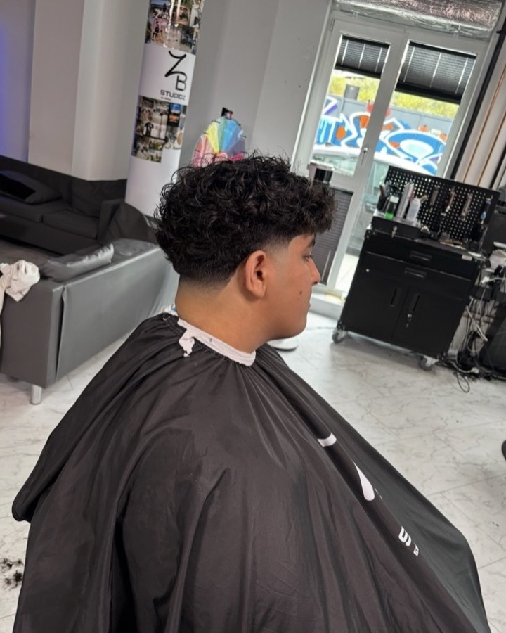 Curly top with faded back and sides